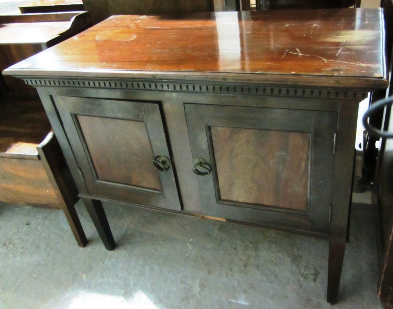 Appraisal: A mahogany two door slide cupboard