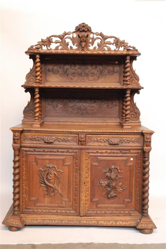 Appraisal: TH C CARVED OAK HUNT CUPBOARD With barley twist and