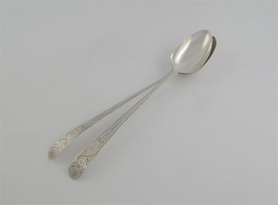 Appraisal: A pair of George III serving spoons bright-cut crested by