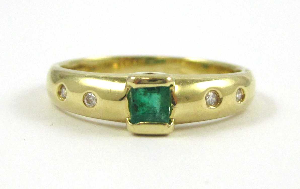 Appraisal: EMERALD DIAMOND AND FOURTEEN KARAT GOLD RING with two round-cut