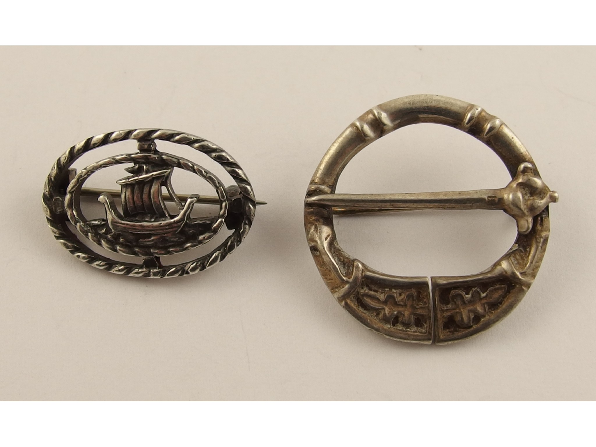 Appraisal: Two silver Alexander Ritchie broochesthe pen annular style brooch features