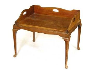 Appraisal: A late George III mahogany butler's tray with pierced handgrips