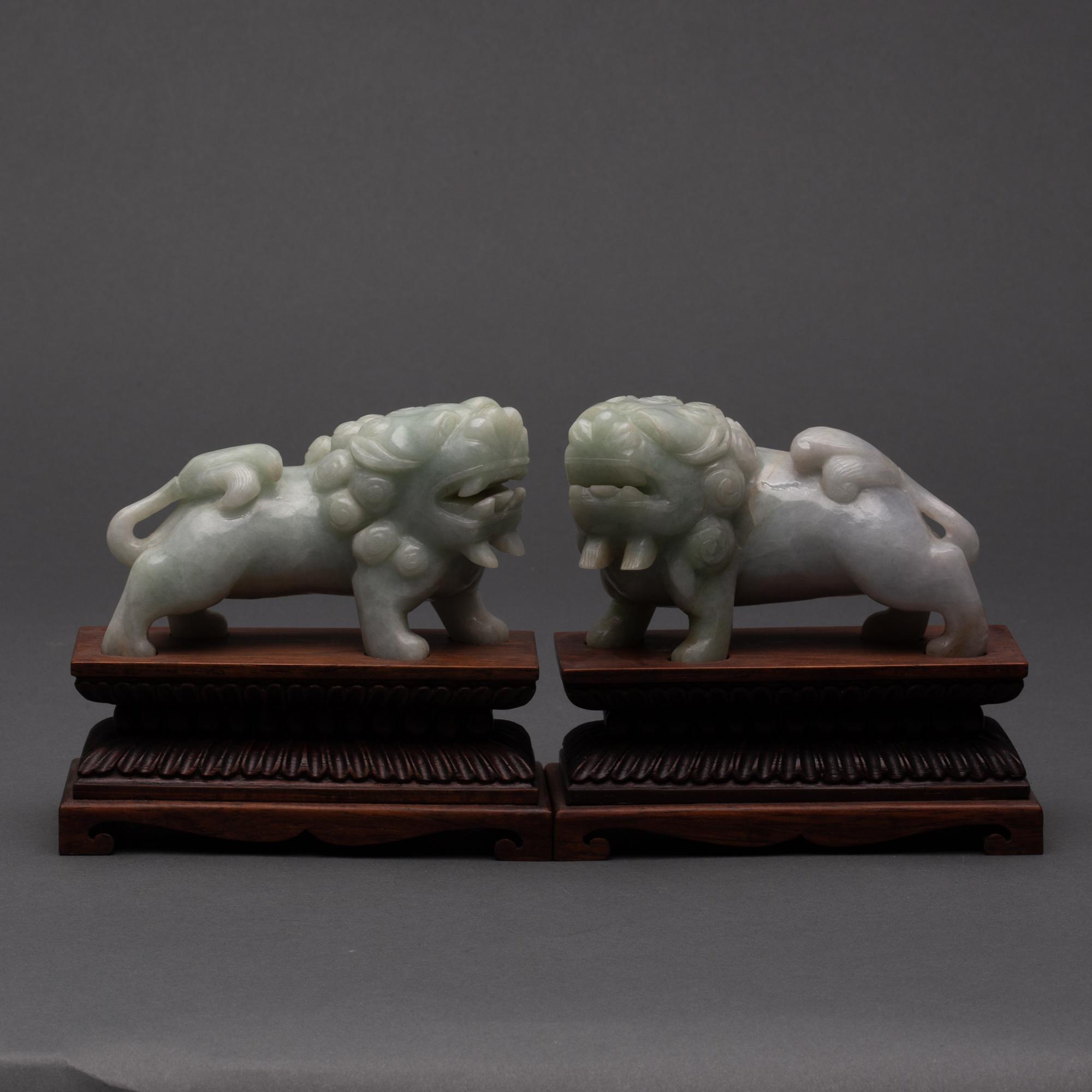 Appraisal: CARVED CHINESE PALE-GREEN JADEITE JADE FOO DOGS TH CENTURY Pair