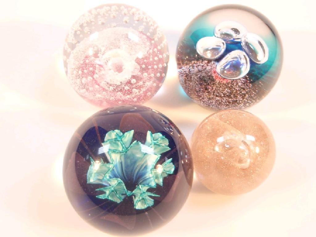 Appraisal: Four Caithness glass paperweights 'Pink Champagne' 'Weather Vein' 'Floral Illusion'