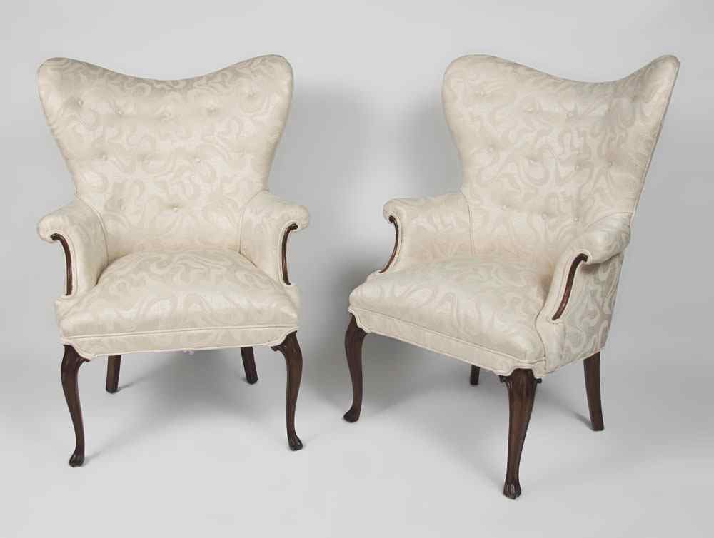 Appraisal: PAIR BUTTERFLY WING BACK CHAIRS White upholstered chairs with carved