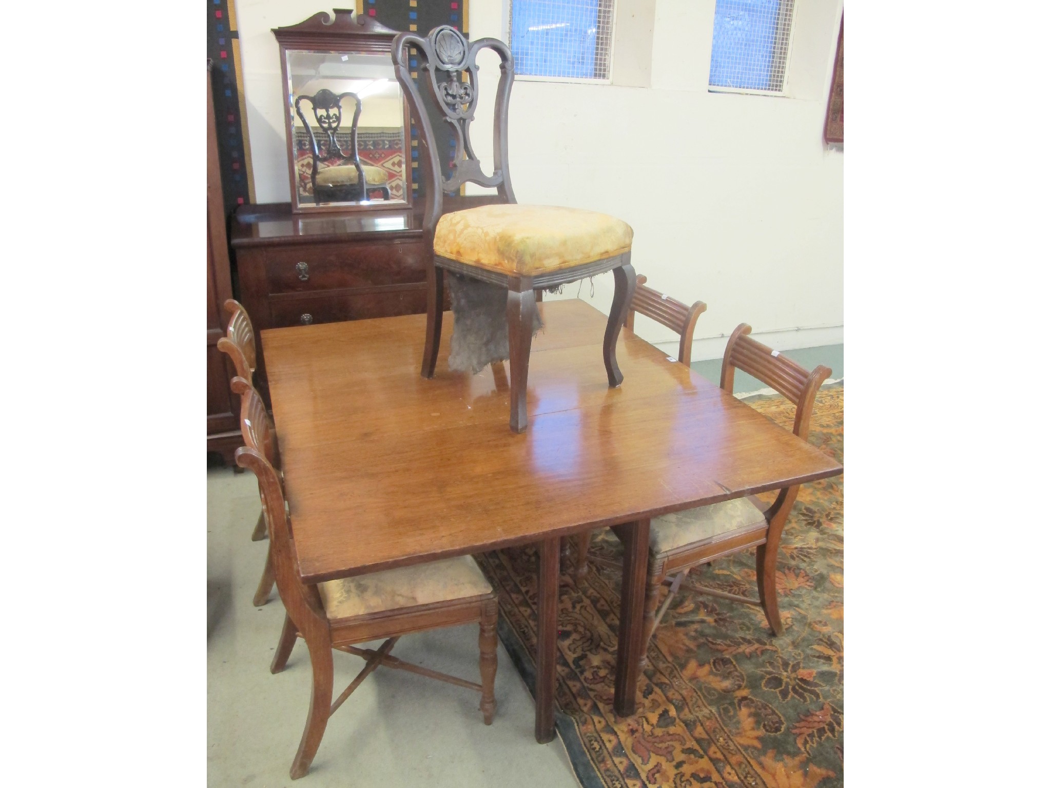 Appraisal: An Edwardian mahogany gateleg table with four dining chairs one