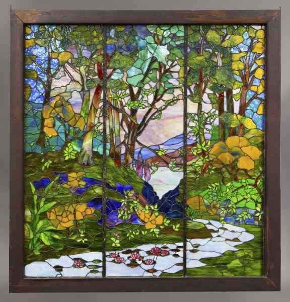 Appraisal: Tiffany style stained glass windowhaving three panels depicting a winding