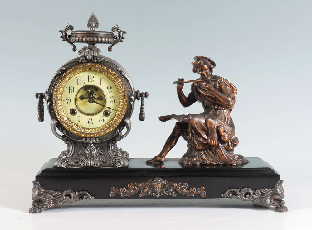 Appraisal: VICTORIAN FIGURAL MANTLE CLOCK Round cast metal case with urn