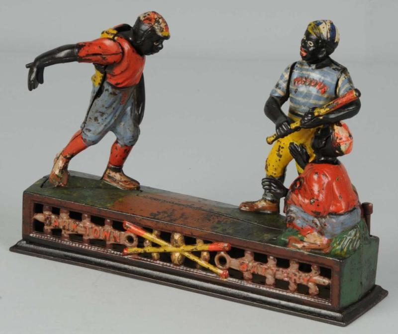 Appraisal: Cast Iron Darktown Battery Mechanical Bank Description Made by J