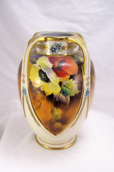 Appraisal: Porcelain Hand Painted Vase Four panel vase with four strap