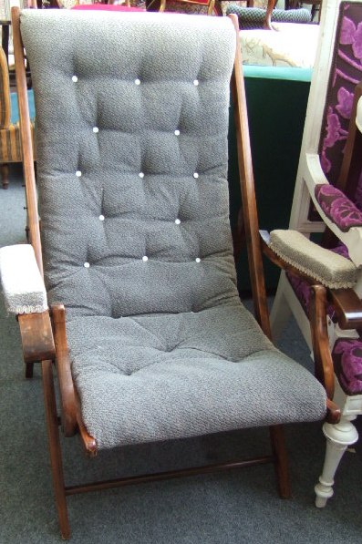 Appraisal: A late th century beech framed folding chair with button