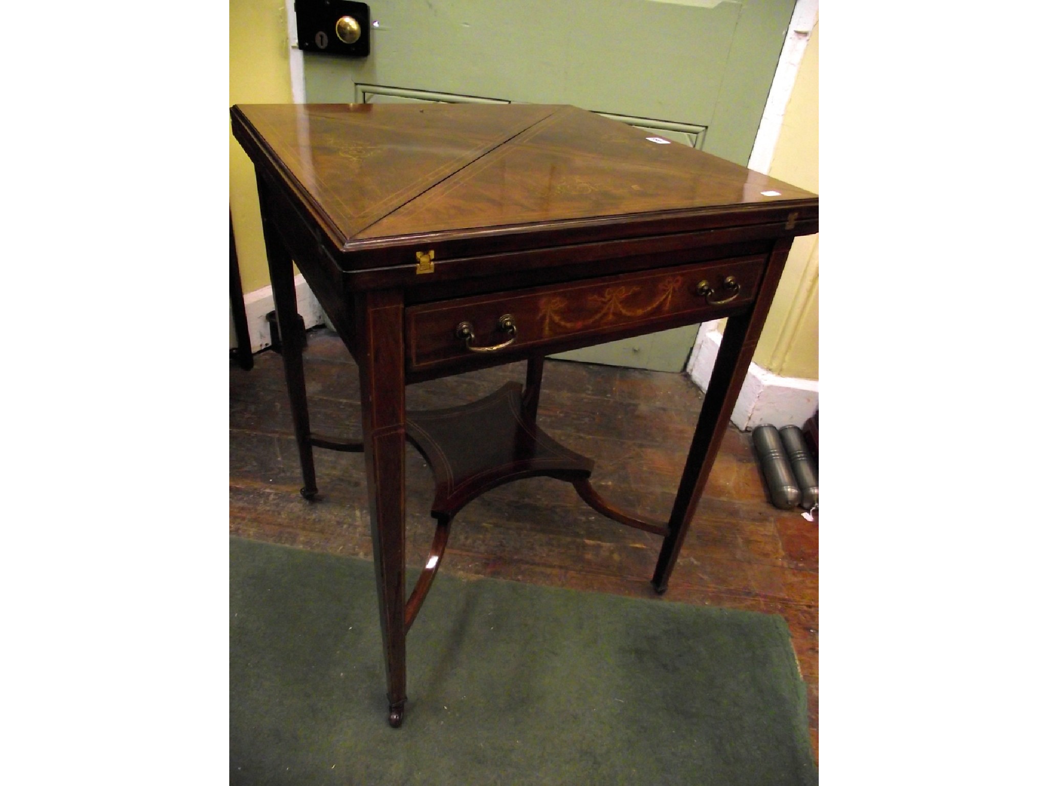 Appraisal: An inlaid Edwardian mahogany envelope card table of usual form