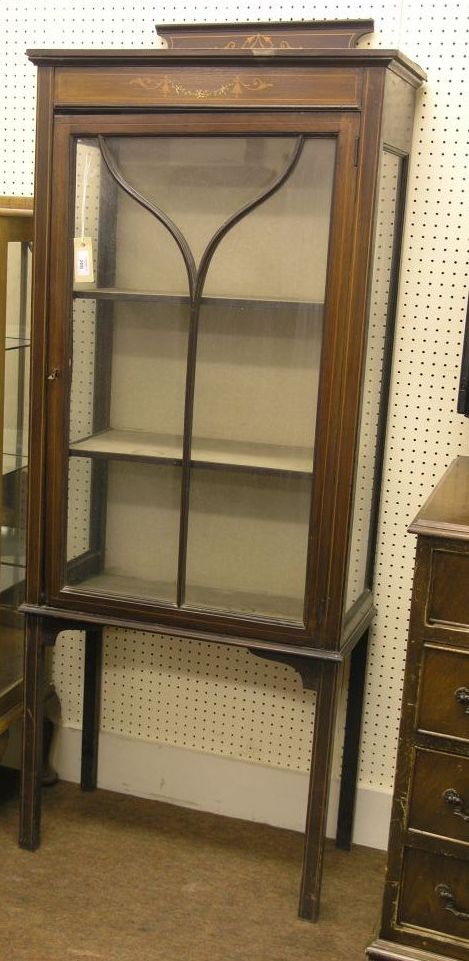 Appraisal: An Edwardian mahogany display cabinet with simulated inlay to the