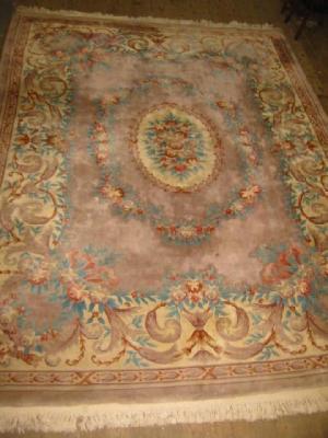 Appraisal: A CHINESE WASHED AND FRINGED CARPET the mink ground with