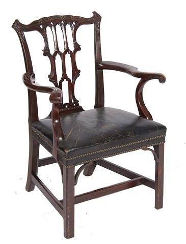 Appraisal: A GEORGIAN MAHOGANY ARMCHAIR with carved vertical splat back overstuffed