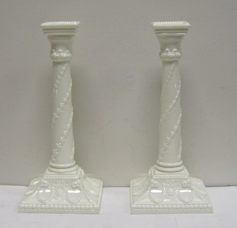 Appraisal: PAIR OF ROYAL WORCESTER BONE CHINA CANDLESTICKS Each white glazed