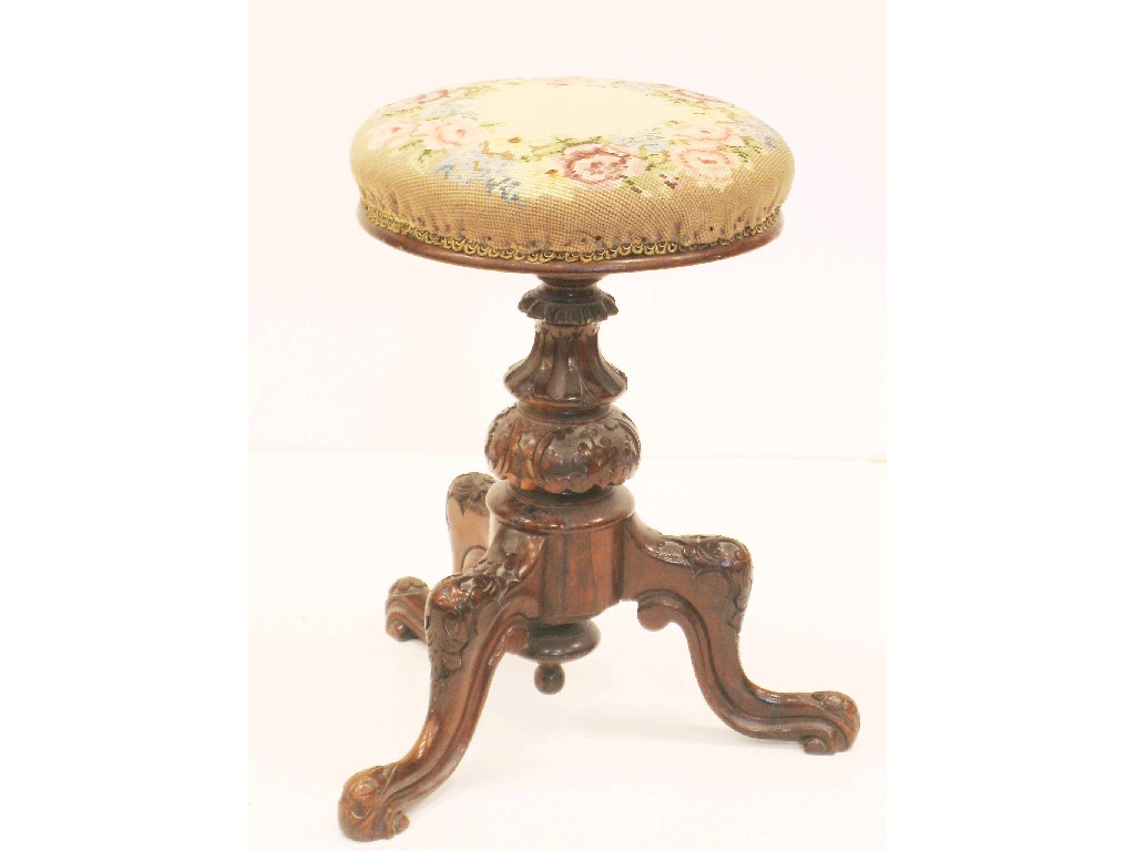 Appraisal: A Victorian rosewood Revolving Piano Stool on carved column and