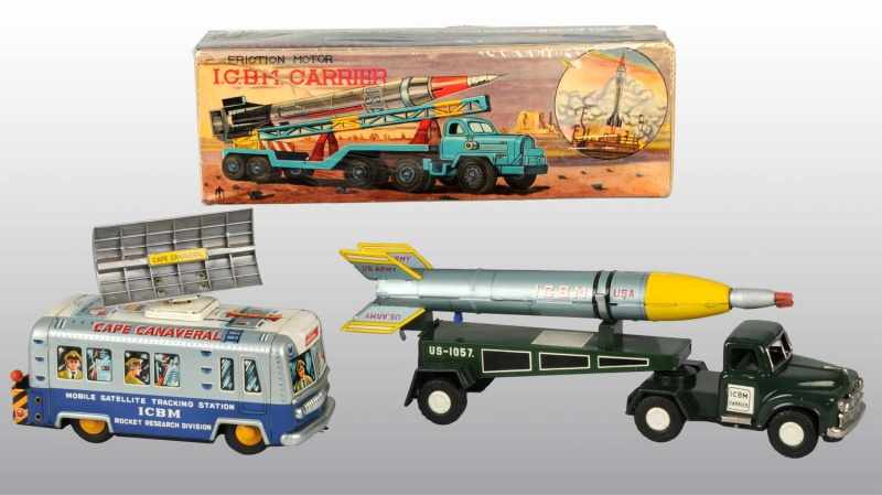 Appraisal: Lot of Tin ICBM Military Toys Description Japanese Working Includes