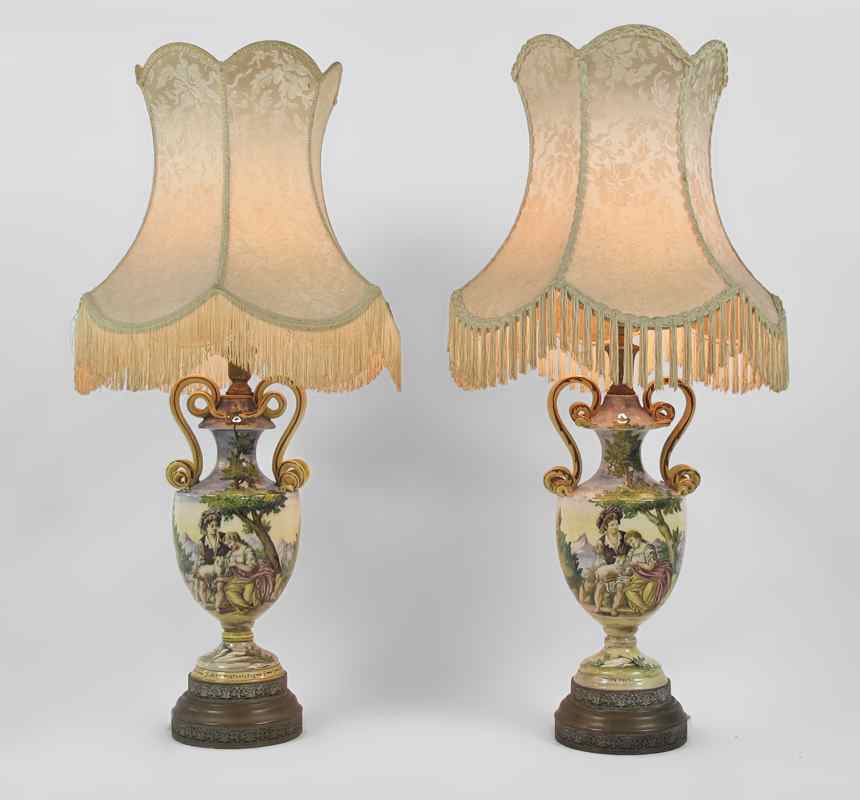 Appraisal: PAIR ITALIAN FAIENCE LAMPS Hand painted bodies with scene of