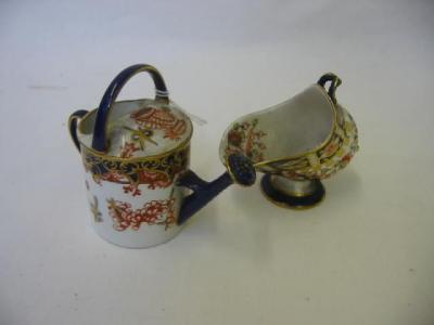 Appraisal: A ROYAL CROWN DERBY PORCELAIN SALT CELLAR modelled as a