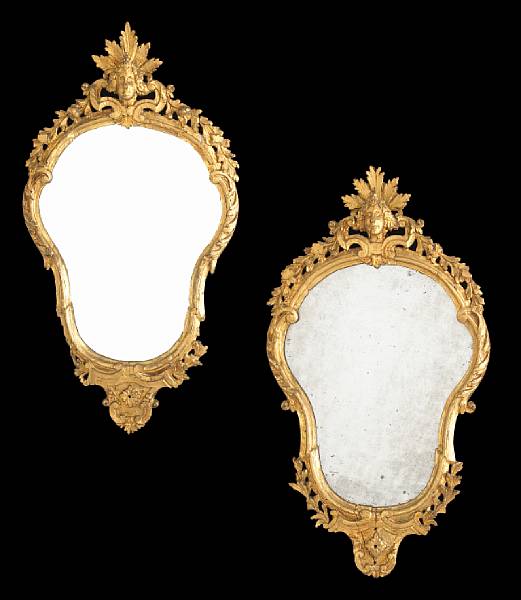 Appraisal: A pair of Italian Rococo giltwood girandole mirrors third quarter