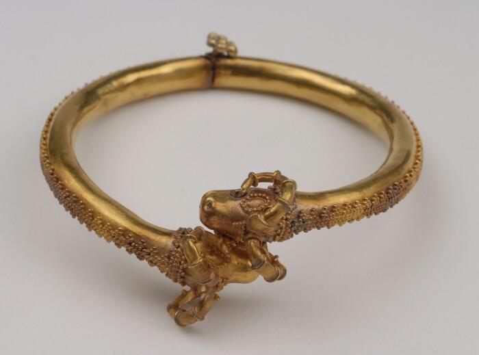 Appraisal: GOLD GRANULATED BRACELET WITH HORNED ANIMAL HEAD TERMINALS Provenance Property