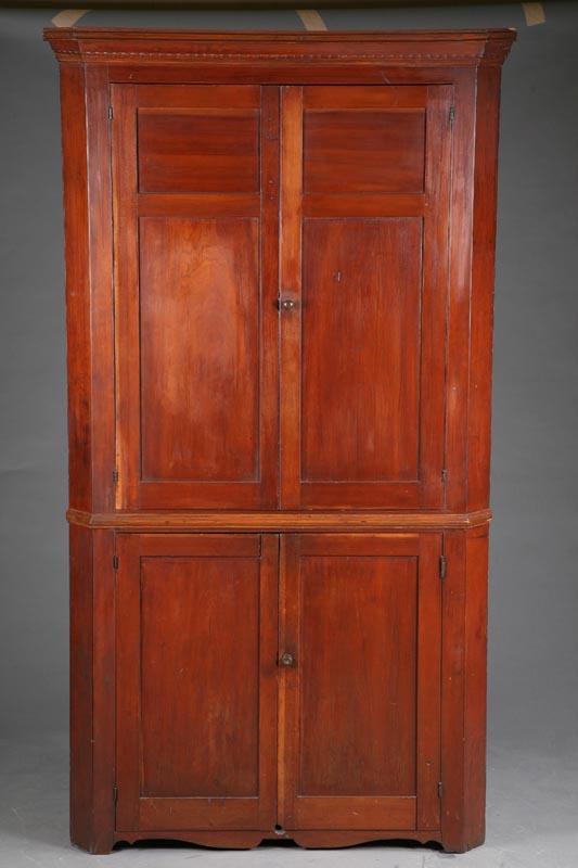 Appraisal: CORNER CUPBOARD Cherry one piece cupboard with a molded cornice