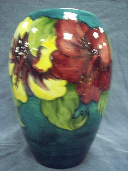 Appraisal: A Hibiscus pattern oval vase of wood-smoke ground cm high