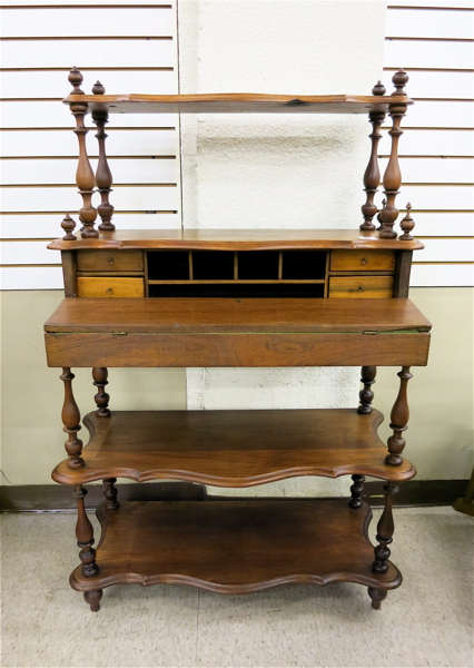 Appraisal: A VICTORIAN WALNUT FOUR-TIER WHAT-NOT DESK American th century having