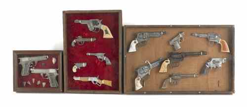 Appraisal: Fourteen framed cap guns th c most Hubley