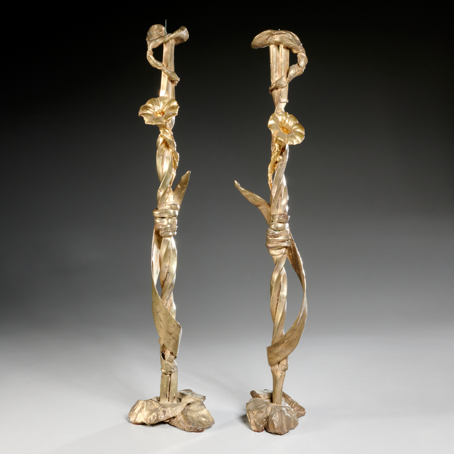 Appraisal: MARA KARETSOS PAIR TALL GILT BRONZE CANDLESTICKS Mara Karetsos Greek