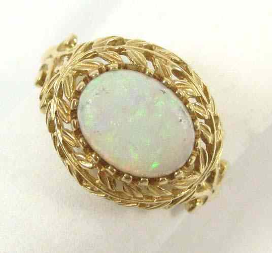 Appraisal: OPAL AND TEN KARAT GOLD RING set with a single