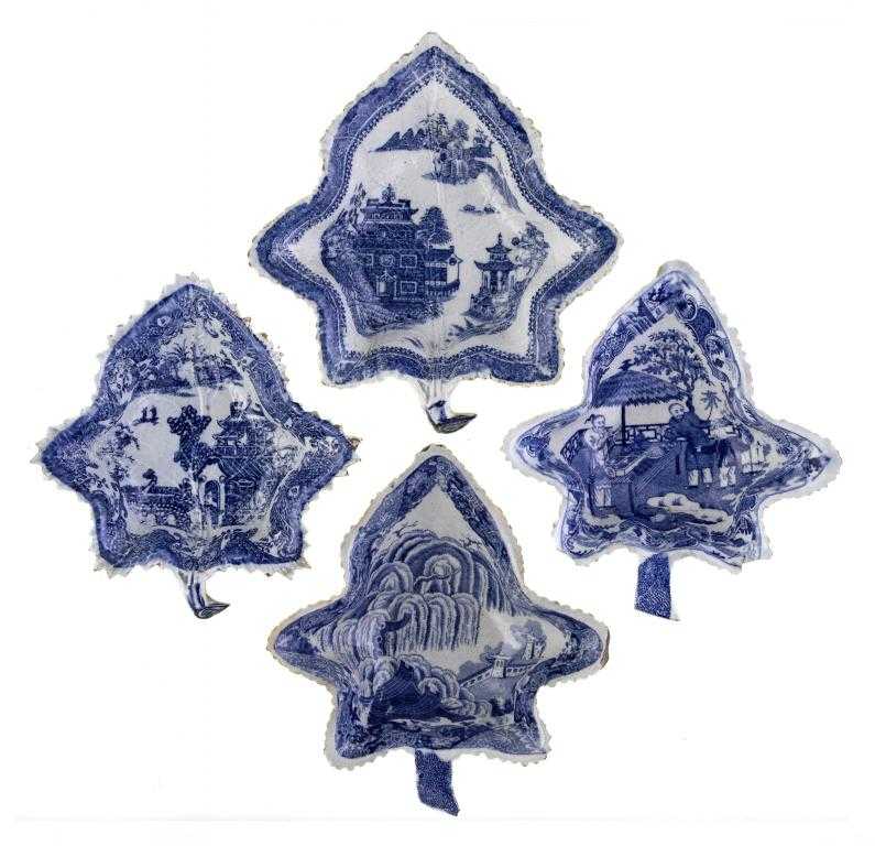 Appraisal: FOUR BLUE PRINTED EARTHENWARE PICKLE DISHES of vine leaf shape