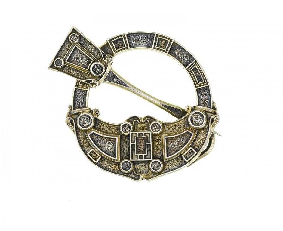 Appraisal: AN IRISH CELTIC REVIVAL PARCEL GILT SILVER ANNULAR BROOCH BY