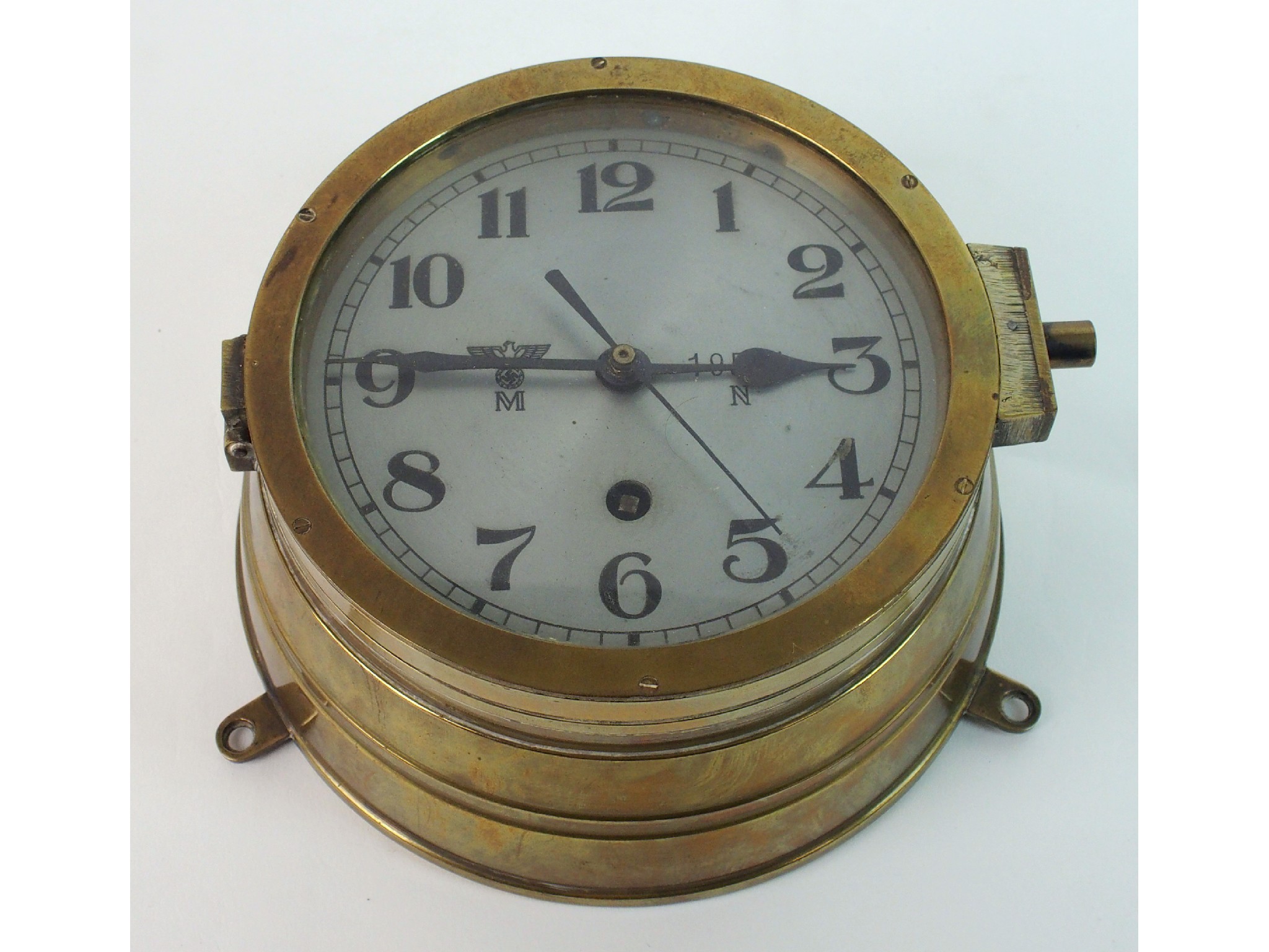 Appraisal: A Second World War German Kriegsmarine bulkhead clock in brass