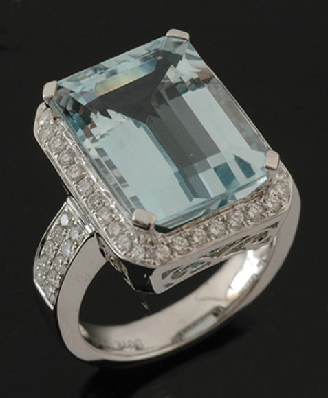 Appraisal: An aquamarine and diamond ring The claw set emerald cut