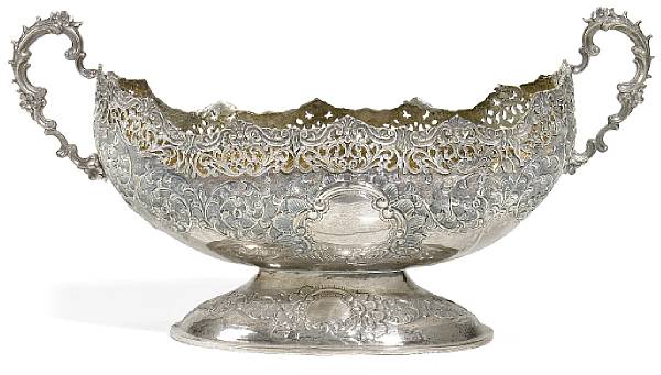 Appraisal: A silver repouss decorated center bowl Of boat form with