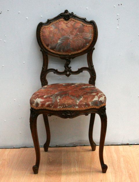 Appraisal: A French upholstered salon chair in walnut