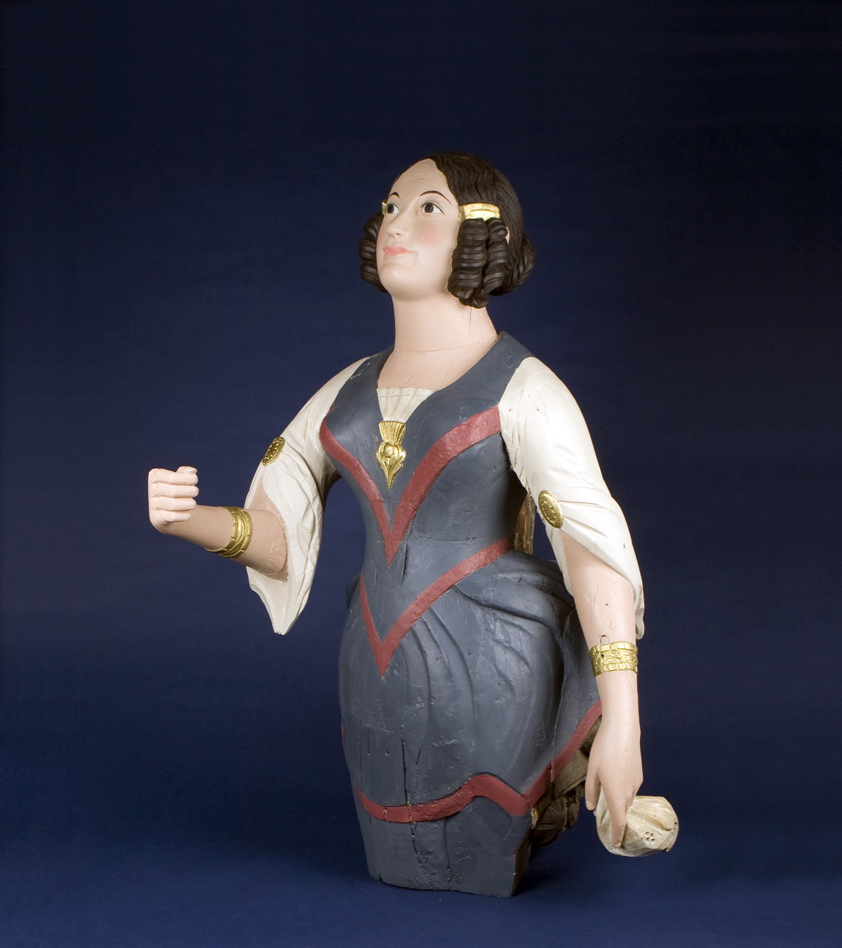 Appraisal: CARVED AND PAINTED FIGUREHEAD OF A WOMAN IN RINGLETS AND