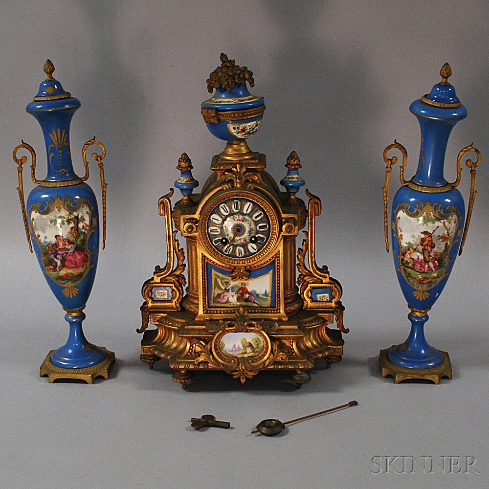 Appraisal: French Garniture Set th century a base-metal mantel clock with