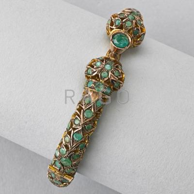 Appraisal: INDIAN GOLD EMERALD HINGED BANGLE th C Pierced ct in