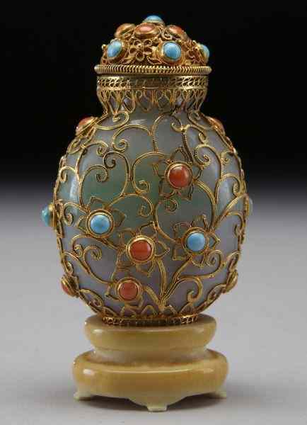 Appraisal: Chinese K gold mounted jadeite snuff bottle International buyers should