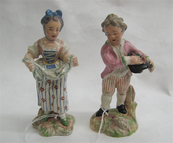 Appraisal: PAIR SOFT PASTE PORCELAIN GERMAN FIGURINES of young girl and