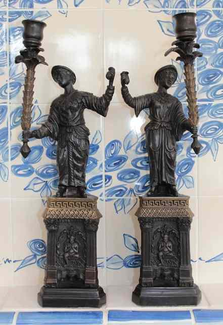 Appraisal: A PAIR OF BRONZE CANDLESTICKS in the form of oriental