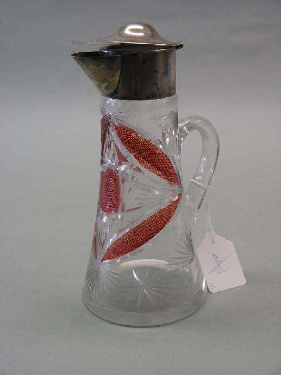 Appraisal: A cut glass claret jug with silver mount in and