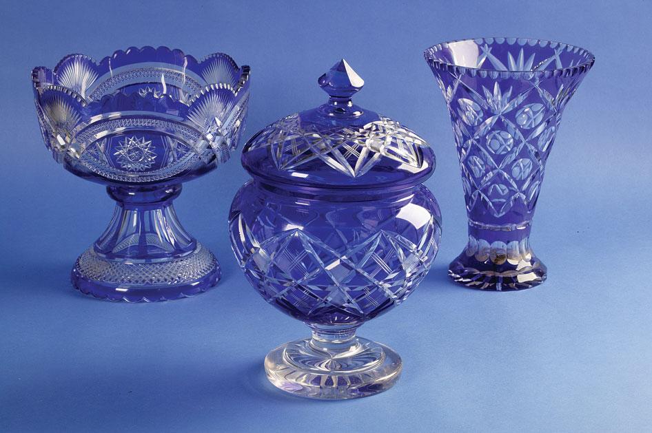 Appraisal: A BLUE OVERLAID GLASS PEDESTAL BOWL the broad bowl with