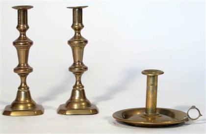 Appraisal: One pair and one single brass chamberstick