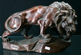 Appraisal: A painted bronzed plaster figure of a standing lion th