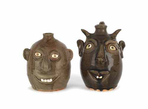 Appraisal: Two Georgia stoneware face jugs by David and Reggie Meaders