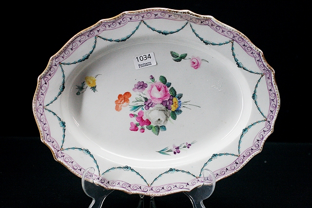 Appraisal: A Derby oval serving plate with scallop border painted with